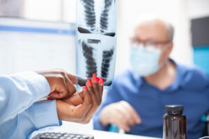 Doctor explaining different types of minimally invasive spine surgery