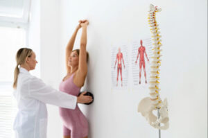 Medical professional evaluating a patient’s posture and spinal alignment during a physical therapy or minimally invasive spine care assessment.
