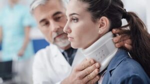 Patient wearing a cervical neck brace during a follow-up evaluation as part of the cervical fusion surgery recovery timeline