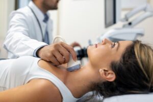 Patient undergoing pre-operative neck evaluation and consultation before cervical fusion surgery