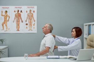 Patient consulting with a healthcare provider during pre-operative preparation for microdiscectomy surgery