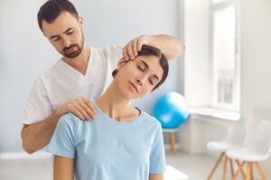 Patient performing guided neck rehabilitation exercises during recovery after cervical fusion surgery