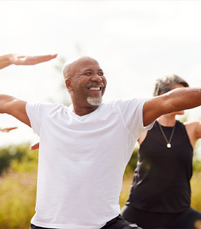 A man does yoga after total joint replacement in Boynton Beach.
