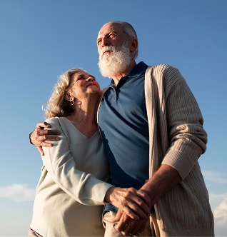 A man holds his wife after total joint replacement in Boynton Beach.